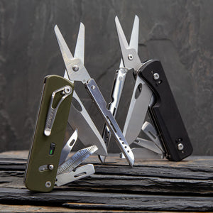 Multitool Roxon Flex Shears with various tools on a dark stone surface