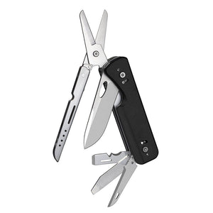 A black modular multitool opened to display a pair of scissors, pen knife, and other implements.