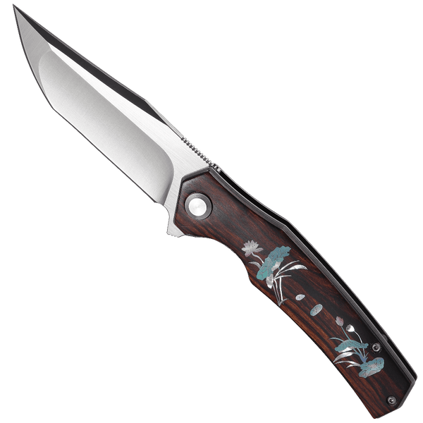 Folding knife with wooden handle and floral designs on a white background