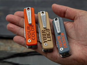 Three small pocket knives with customizable text on a hand