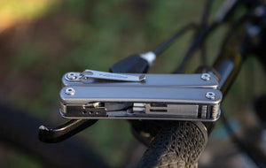 Flex Modular Bicycle Multitool displayed on the handle of a bicycle.
