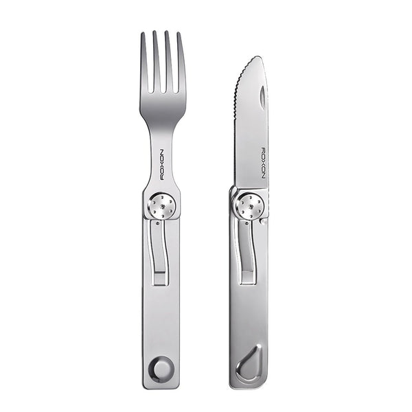 Stainless steel fork and knife set on a white background