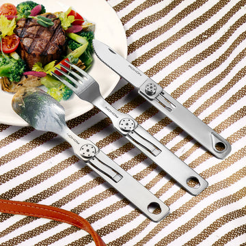 Spoon, fork and knife arranged on a plate with food