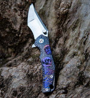 Folding knife with a decorative handle on a wooden surface