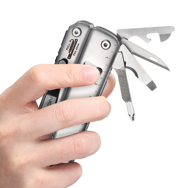 Multitool held in hand displaying tool locking mechanism and scale on side of the multitool