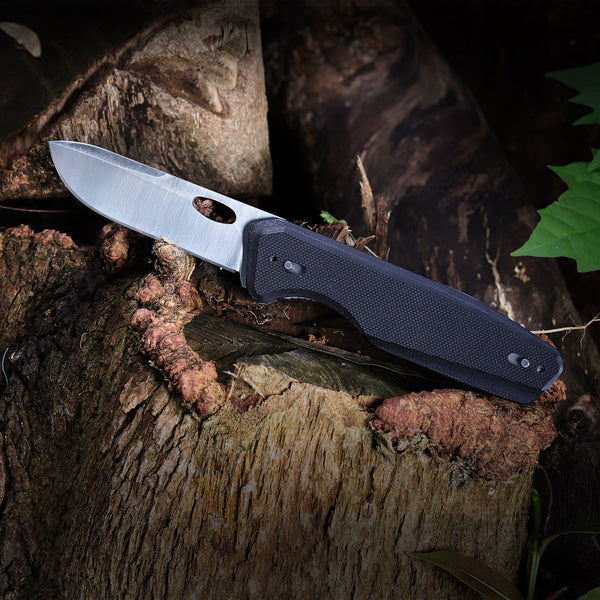 Folding knife against wood