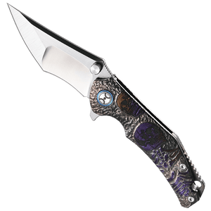 Folding knife with decorative handle on a white background