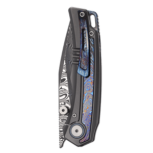 Folding knife with a decorative handle on a white background
