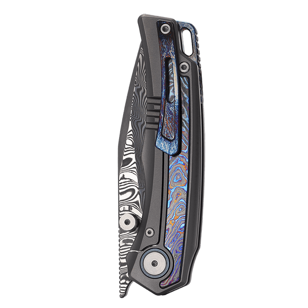Folding knife with a decorative handle on a white background