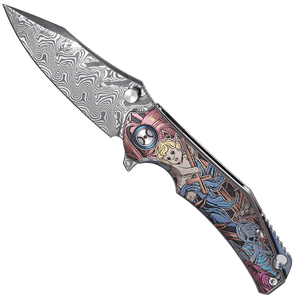 Decorative folding knife with a detailed handle on a white background