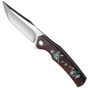 Folding knife with wooden handle and floral designs on a white background