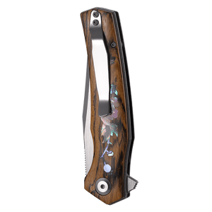 Wooden folding knife with floral inlay on a white background