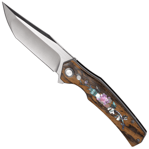Folding knife with wooden handle and floral inlay on a white background